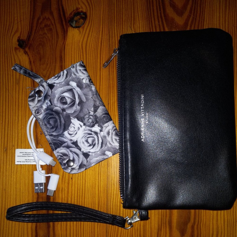 black wristlet/clutch with power supply for devices